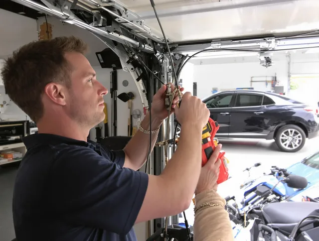 Barrington Garage Door Repair safety certified technician performing cable replacement in Barrington