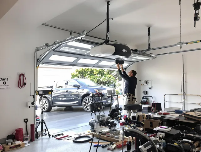 Barrington Garage Door Repair specialist installing smart garage door opener system in Barrington home