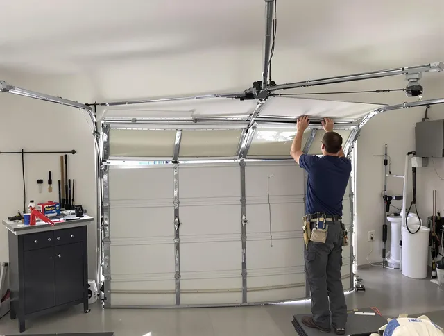 Barrington Garage Door Repair specialist performing precise section replacement on Barrington garage door